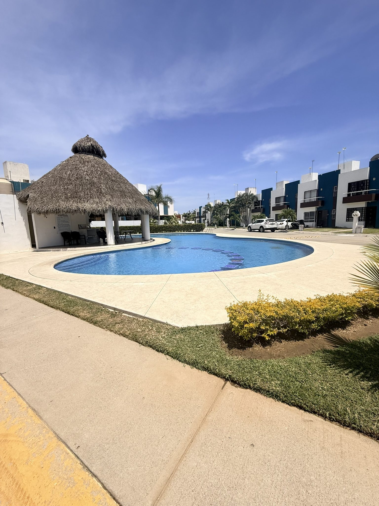 Pool with palapa at a residential community